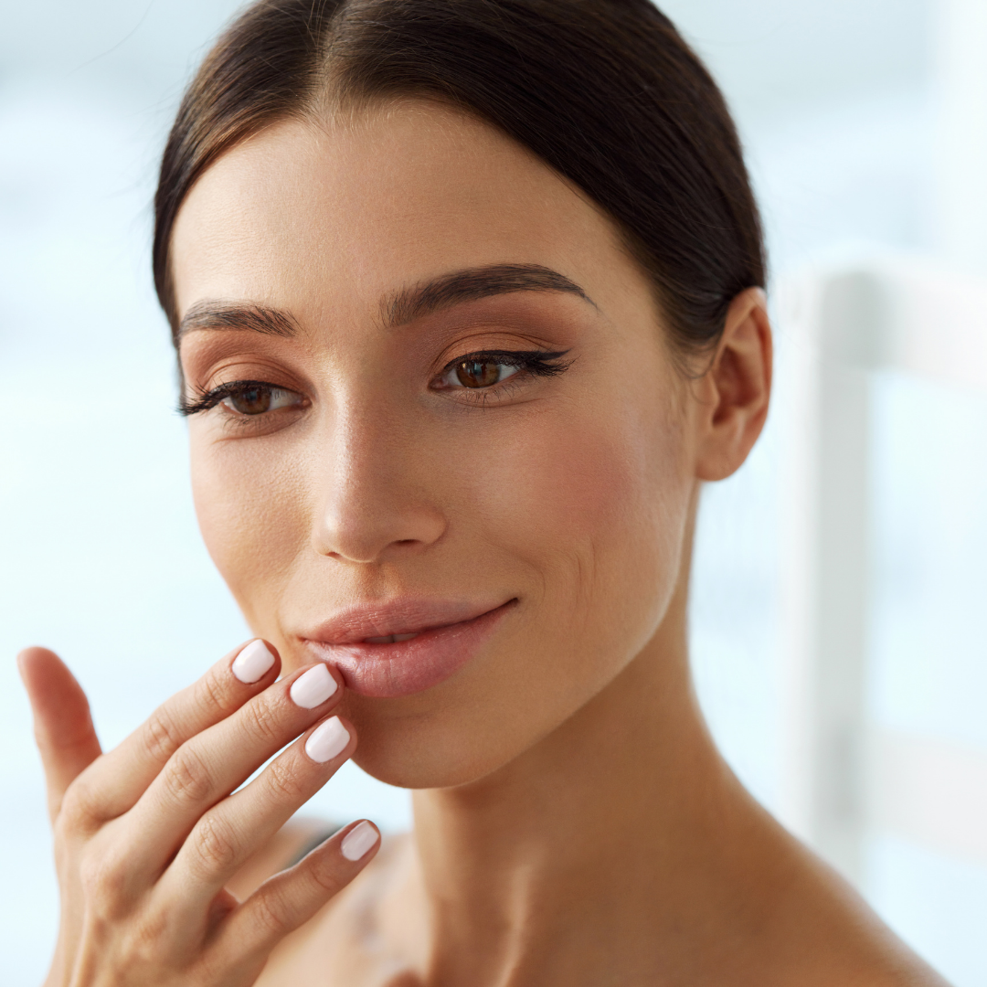 Woman who is pleased with her lip fillers